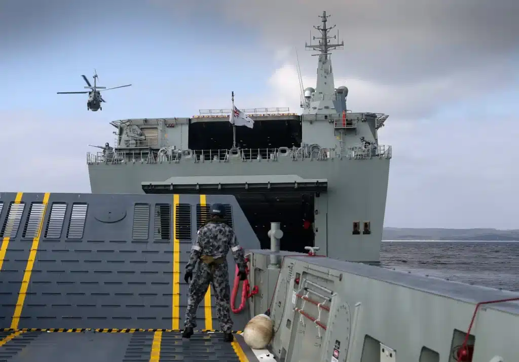 The LCM-1E – pictured here closely operating with a Canberra class LHD – is a class of amphibious mechanised landing craft manufactured by Navantia at their factory in San Fernando. Photo: Royal Australian Navy